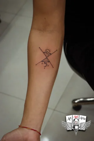 Minimal Line Art Forearm Tattoo | Art and Artist Tattoo Shop Minimal line art forearm tattoo done at Art and Artist Tattoo Shop, fine line black ink tattoo design