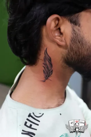 Feather Neck Tattoo in Tattoo Raipur | Art and Artist Tattoo Studio Feather tattoo on neck behind ear done at tattoo raipur studio with clean black ink