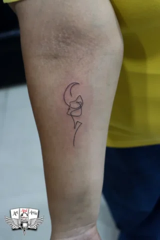 Minimal Line Art Tattoo by Tattoo Artist in Raipur | Art and Artist Tattoo Studio Minimal line art tattoo on forearm done by tattoo artist in raipur with fine black ink